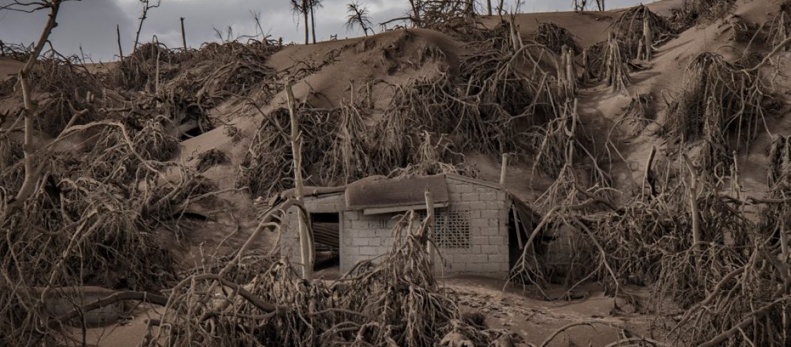 TAAL VOLCANO ISLAND, PHILIPPINES - JANUARY 14: A house near Taal Volcano's crater is seen buried in volcanic ash from the volcano's eruption on January 14, 2020 in Taal Volcano Island, Batangas province, Philippines. The Philippine Institute of Volcanology and Seismology raised the alert level to four out of five, warning that a hazardous eruption could take place anytime, as authorities have evacuated tens of thousands of people from the area. An estimated $10 million worth of crops and livestock have been damaged by the on-going eruption, according to the country's agriculture department. (Photo by Ezra Acayan/Getty Images)